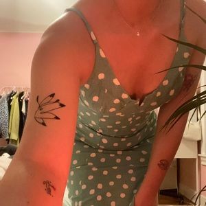 the sweetest green polka dot dress! structured cups on bodice and slit on leg!